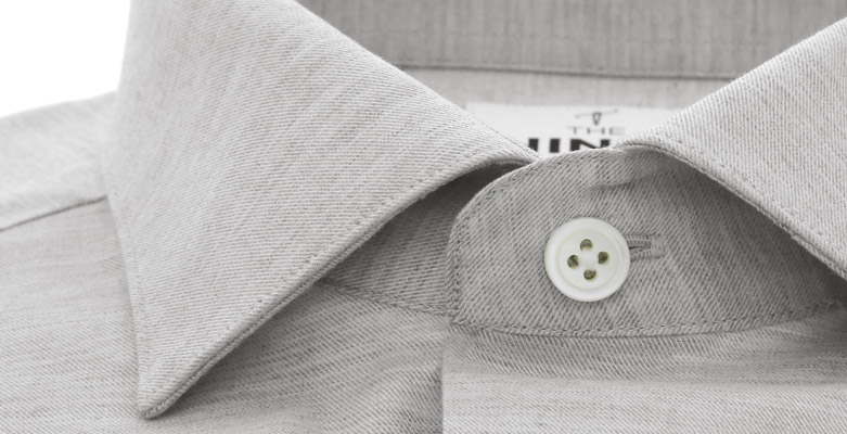 Un trou horizontal pour le bouton supérieur d'une chemise